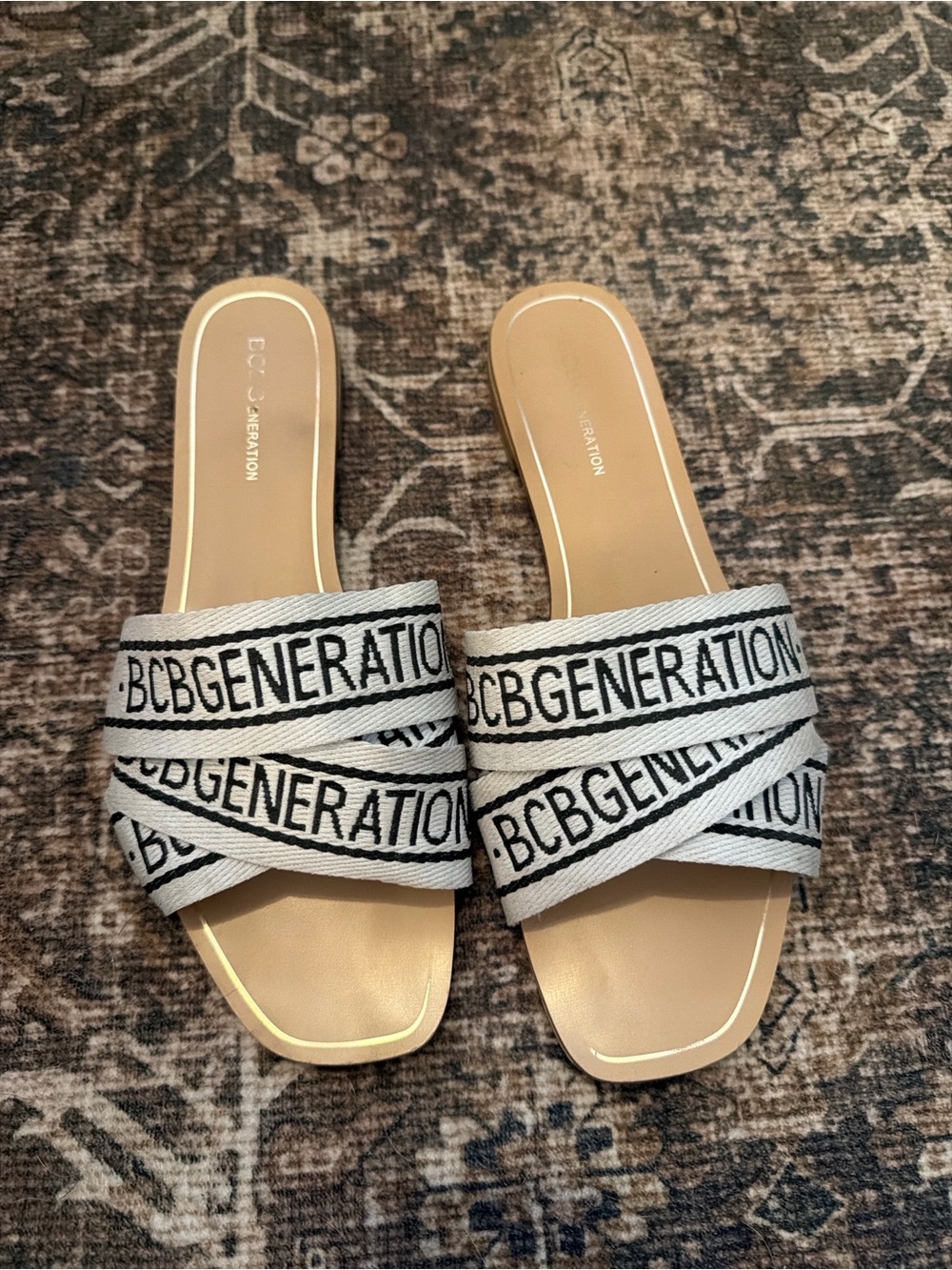 BCBGeneration Tan Slide Sandals with White and Black Branded Crossover Straps